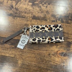Repurposed Vintage Louis Vuitton and calf hair wristlet
